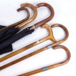 2 umbrellas, 2 walking sticks with silver collars, and 2 others (6)