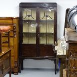 An Edwardian mahogany display cabinet, with 2 lattice glazed doors, on square tapered legs, W92cm,