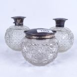 A pair of glass scent bottles, and a matching powder bowl, all having silver and mother-of-pearl