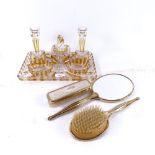 An amber overlay glass dressing table set on tray, and a Vintage 3-piece dressing table brush and