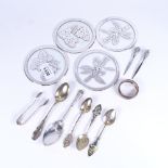 Silver-gilt and enamel souvenir spoons, a napkin ring, coasters etc