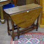 An 18th century joined oak gateleg table, with single frieze drawer, on turned legs, L92cm, H71cm