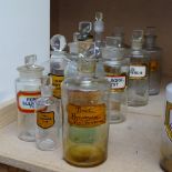 11 various glass Chemist's bottles and stoppers, with original drugs labels, tallest 24cm