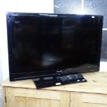 A Sharp 32" flat screen television with remote, GWO