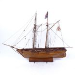 A handmade wooden sailing ship on stand, height 45.5cm