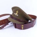 An Army cap with badge, and a Sam Brown belt