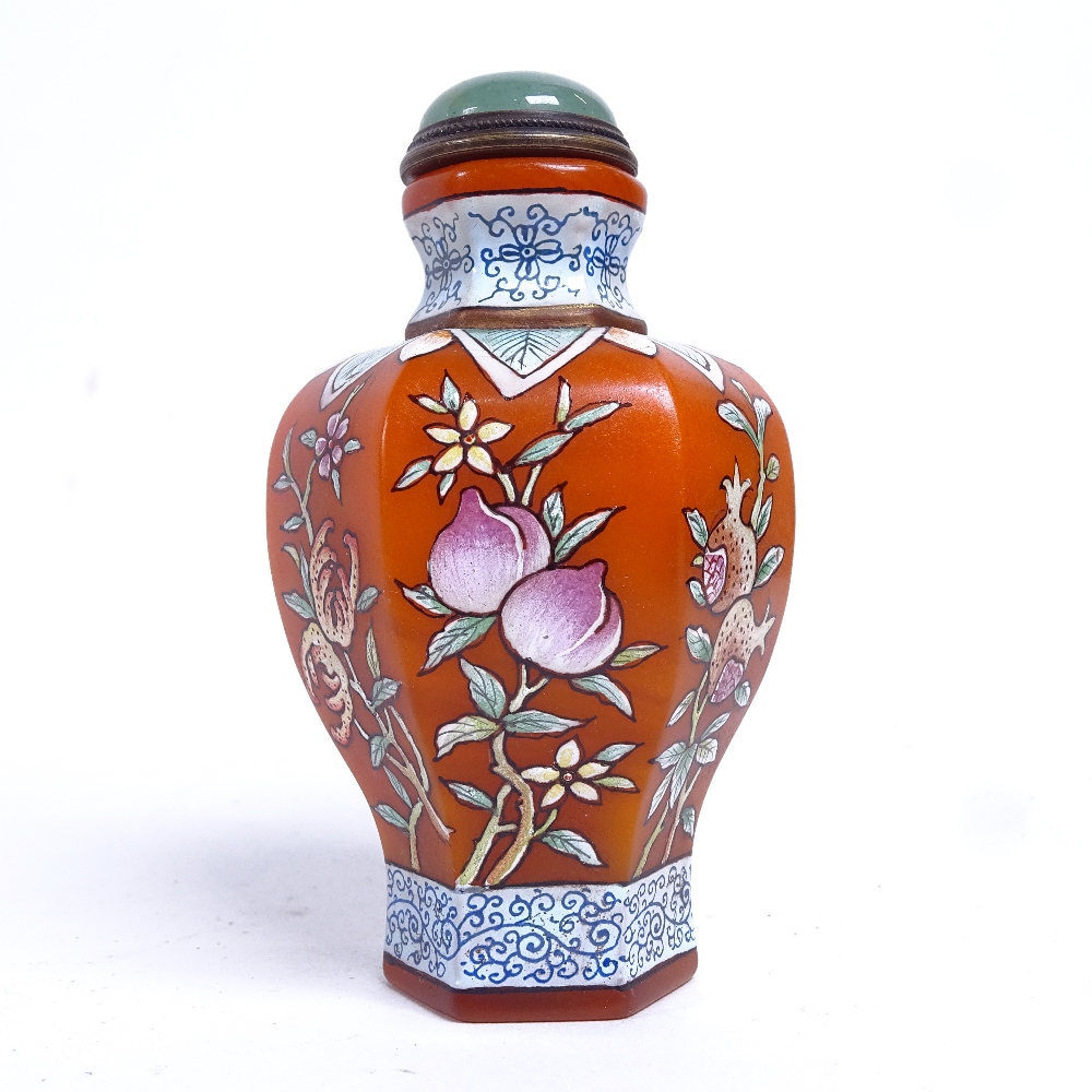 A Chinese Peking orange glass snuff bottle, hand painted peach and pomegranate decoration, with