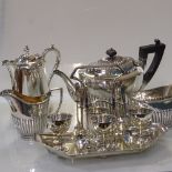 A silver plated tea set of half-fluted form, a n Elkington plate hot water jug, and a 4-piece egg