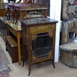 A Victorian rosewood music cabinet, having a raised shaped mirror-back, single drawer, glazed
