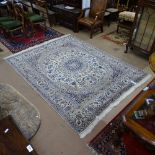 A large cream Persian Nain wool carpet, 255cm x 195cm