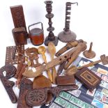 A tray of treen items, including nutcracker, boxes, and an iron candlestick, and various postage