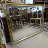 A large modern gilt-framed bevel-edge wall mirror, 136cm x 106cm