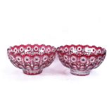 A pair of ruby overlay cut-crystal fruit bowls, 23cm diameter