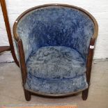 A 1920s French Art Deco tub chair, in the manner of Paul Follot, the oak frame with fluted front