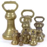 A graduated set of brass bell weights, largest 7lbs