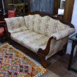 A Regency rosewood scroll arm settee, with applied acanthus leaf carved decoration, on scrolled