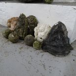 A collection of garden concrete wall fountains, a ram's-head mask, balls etc (9)