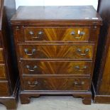 A reproduction mahogany chest with fold over top, 4 graduated drawers under, bracket feet, W63cm,