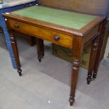 An Edwardian mahogany writing table with green leather skiver, single frieze drawer, on turned legs,