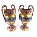 A modern pair of Egyptian Revival gilded and painted urn vases, height 41cm