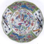 A large Japanese green ground lobed charger, central courtyard scene with phoenix butterfly and