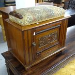 A late Victorian mahogany music stool with adjustable seat, carved panelled door and shelved