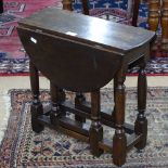 A small oak drop leaf table, on baluster legs, W49cm, H47cm