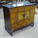 A Chinese elm side cabinet, with fitted drawers and cupboards, on scrolled feet, W92cm, H79cm, D41cm