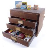 A table-top filing chest of drawers, containing various Vintage rulers, writing instruments etc