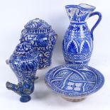 A Toledo blue and white pottery jug, 27cm, a graduated pair of jars, a dish on foot, and a painted