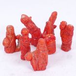 A group of Chinese carved and polished coral figures, mostly of Buddha, largest height 8cm (6)