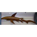 A carved hardwood sculpture of a shark, by Anderson G Warren Pitcairn Island, length 97cm