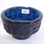 A heavy handmade sculpted glass bowl with geometric frieze, diameter 17cm