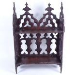 A 19th century carved and pierced mahogany Gothic bookshelf, width 33cm, height 48cm