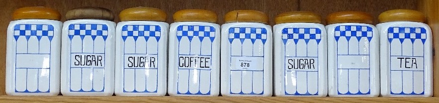 A set of 8 Continental ceramic storage jars with wooden lids, height 16.5cm