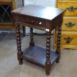 A 1920s oak single drawer side table, on barley twist legs, W47cm, H68cm, D31cm