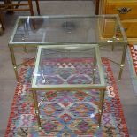 A rectangular brass-framed and clear glass-top coffee table, with shaped stretchers on turned