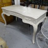 A white painted serpentine-front writing desk, with 3 frieze drawers and cabriole legs, L140cm