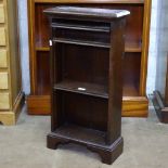 A small narrow oak open bookcase with adjustable shelves, W40cm, H76c, D16cm