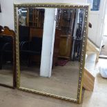 A large modern gilt-framed bevel-edge wall mirror, 127cm x 99cm