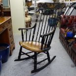 An ebonised and gilded stick-back rocking chair