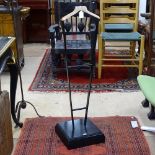 An ebonised and polished wood valet stand, H95cm