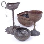 A group of Eastern embossed metalware, including a candlestick, 21.5cm, a copper goblet, and 2 bowls