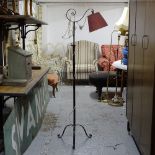 A wrought-iron standard lamp