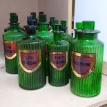 A set of 5 green fluted glass Antique Apothecary's bottles and stoppers, with original labels,