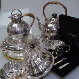 A silver plated spirit kettle on stand, a Jersey pot with wicker handle, muffin and entree dishes