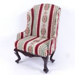 A doll's wingback armchair, height 40cm (1 leg missing)