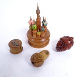 A group of treen items, including miniature turned boxwood novelty tape measure, acorn needle