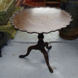 A 19th century mahogany tilt-top table, with scalloped dish top, on tripod legs, W75cm