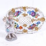 A 19th century hand painted and gilded floral porcelain dish, crossed swords mark, and a porcelain